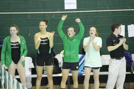 The Marshall University swimming and diving team celebrates.