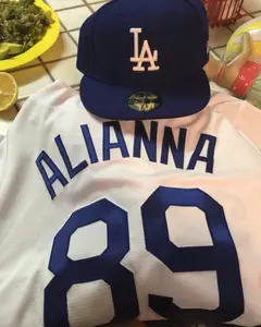 The hat and jersey for former Marshall shortstop Alianna Telles (2009-12).