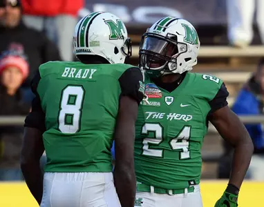 Dec 16, 2017; Albuquerque, NM, USA; Marshall Thundering Herd running back Keion Davis (24) celebrates a touchdown with wide receiver Tyre Brady (8) during the first half against the Colorado State Rams in the 2017 New Mexico Bowl at Dreamstyle Stadium. Mandatory Credit: Joe Camporeale-USA TODAY Sport