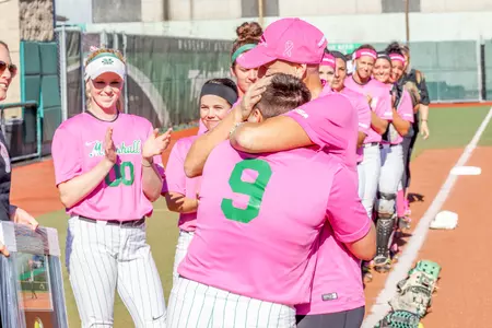 Jordan Dixon hugs her mom, Linda, during pregame ceremonies on April 8th.