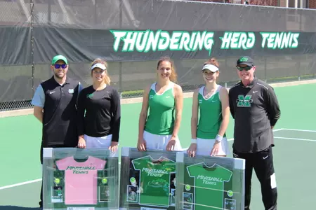 (L-R) Assistant coach Jason Winegar, seniors Stephanie Smith, Marija Bogicevic, Maddie Silver and head coach John Mercer pose for a photo during the Herd's senior day festivities.