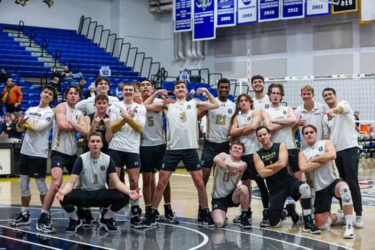 Men's Volleyball team generic huddle happy