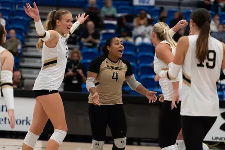 Happy volleyball win huddle celebration