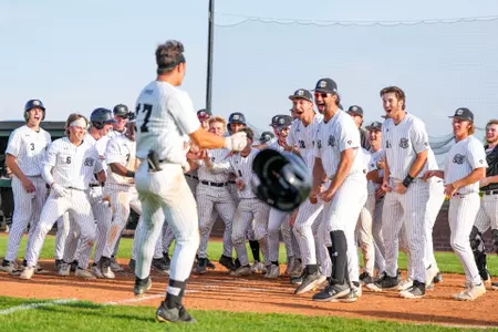 Justin Osterhouse comes home after a walk-off grand slam