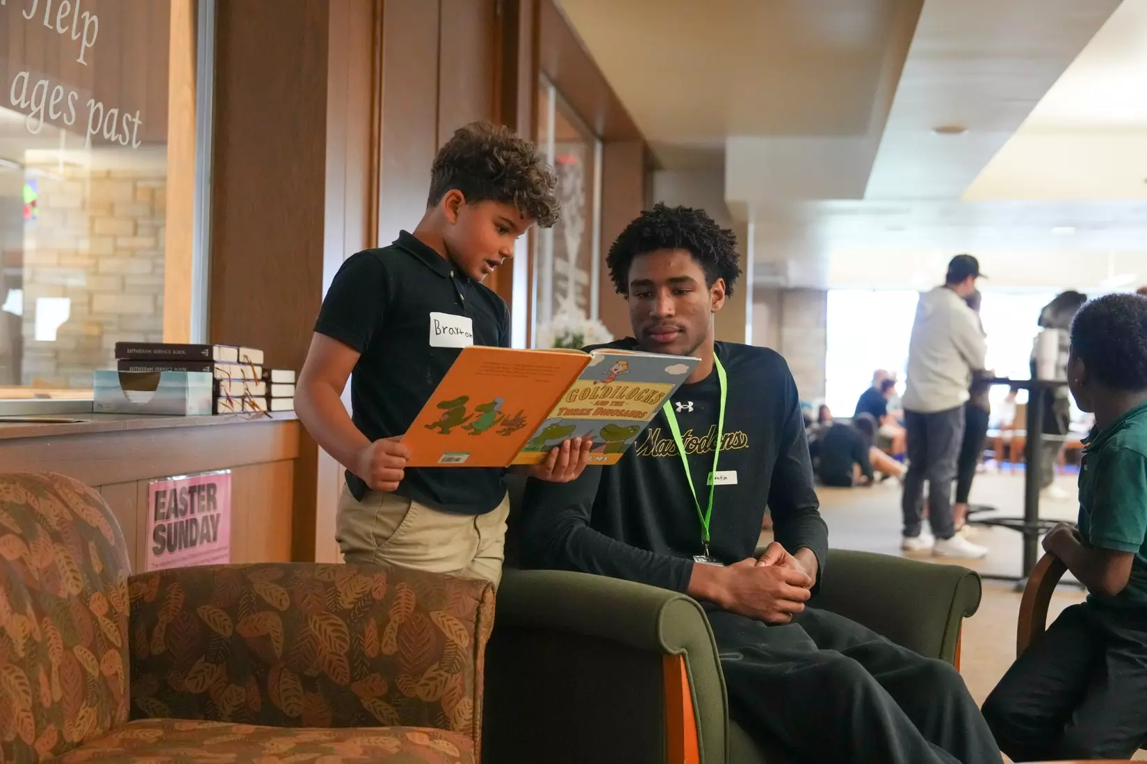 Reading to Holy Cross students