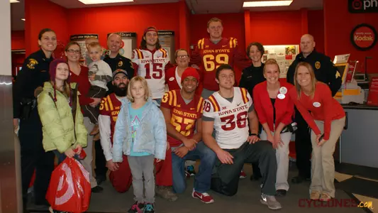 ISU Football Helps Kids Shop With A Cop