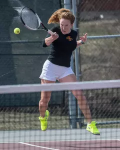 Margarita Timakova returns tennis ball.
