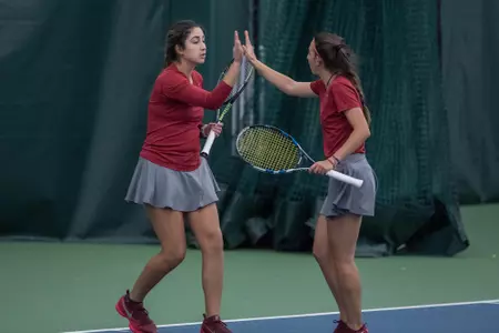 Karen Alvarez and Annabella Bonadonna give each other a high-five.