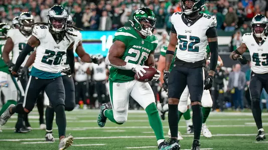 New York Jets running back Breece Hall (20) scores a touchdown during the second half of an NFL football game against the Philadelphia Eagles, Sunday Oct. 15, 2023, in East Rutherford, N.J. (AP Photo/Bryan Woolston)