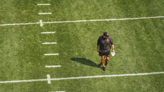 Overhead photo as Matt Campbell walks the field at practice.