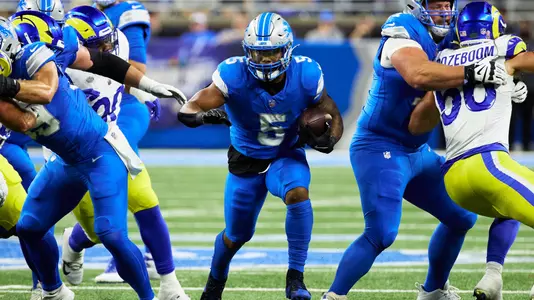 Detroit Lions running back David Montgomery (5) rushes against the Los Angeles Rams in the first half of an NFL football game in Detroit, Sunday, Sept. 8, 2024. (AP Photo/Rick Osentoski)