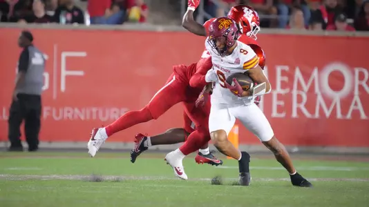 Jayden Higgins runs after catching a pass against Houston