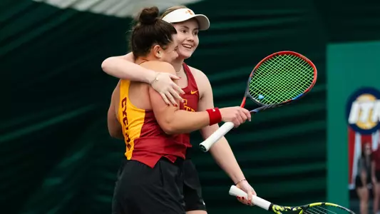 Suzanie Pretorius and Valeska San Martin Ramirez celebrate a doubles win against North Texas.
