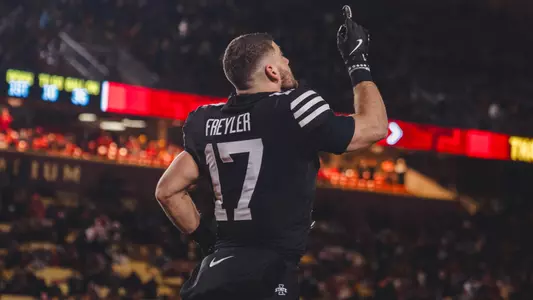 Beau Freyler runs out onto the field on Senior Night against Kansas State.