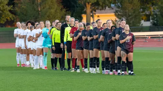 Players line up for the national anthem