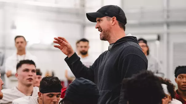 Iowa State head coach Jimmy Rogers speaks with the team after a spring practice