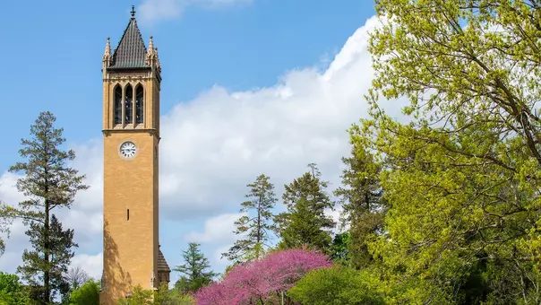 The campanile on Iowa State's campus with spring foliage
