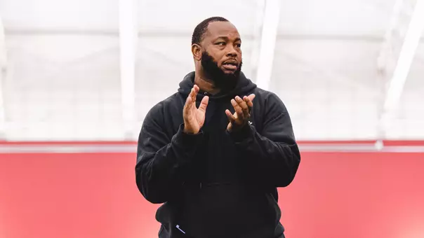 Running backs coach John Johnson clapping during 2026 spring practice.