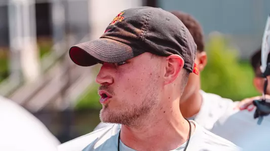 Safeties Coach Pete Menage looks on at a spring football practice in 2026.