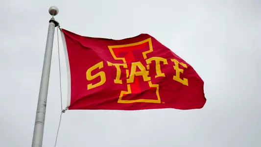 I-State flag blowing in wind at 2026 season opener against SEMO at Jack Trice Stadium.