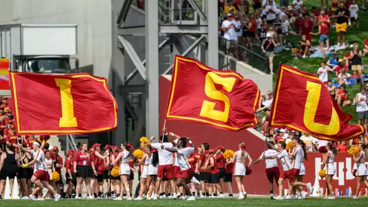 Spirit Squad runs with ISU flags during 2026 season opener against SEMO.