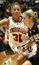 Megan Duffy tries to drive on Indiana's Leah Enterline during the first half.