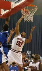 A.J. Ratliff puts up a shot while being defended by Kentucky's Rajon Rondo during the second half. Ratlilff finished with 21 points as Indiana defeated Kentucky 79-53.