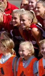 The Hoosier women's soccer team poses for a picture after a summer camp hosted by the IU program.