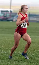 Senior Larra Overton was the first Lady Hoosier to cross the finish line at the Community 5k run Friday night.
