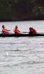 An IU coxswain addresses her crew.