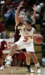 Indiana's Cyndi Valentine (3) is defended by Minnesota's Shannon Schonrock during the first half. (AP Photo/Darron Cummings)