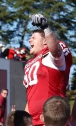 Senior offensive lineman Justin Frye celebrates with Hoosier fans after Indiana's 31-28 win over No. 15/13 Iowa on Oct. 14.