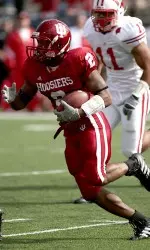 Marcus Thigpen recorded his third touchdown on a kickoff return this season to open the second half against Illinois.