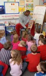 Junior forward D.J. White reads to children at Grandview Elementary School in Bloomington.