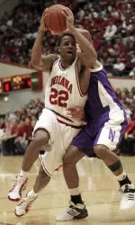 Marshall Strickland fights his way past Northwestern's Sterling Williams during the first half.