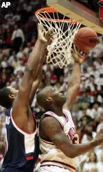 Indiana's Marco Killingsworth, right, puts up a shot against Connecticut's Hilton Armstrong during the first half. (AP Photo/Tom Strattman)