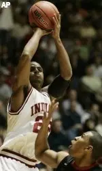 Indiana's Marshall Strickland, left, shoots over San Diego State's John Sharper in the first half of a NCAA tournament first round basketball game in Salt Lake City, Utah, Thursday, March 16, 2006.(AP Photo/Douglas C. Pizac)