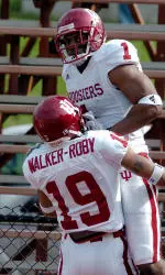 Jahkeen Gilmore and Brandon Walker-Roby celebrate a Gilmore touchdown at the Cream and Crimson game.