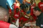 IU head coach Kelvin Sampson speaks to his team at halftime of a game in Kuwait. Sampson is coaching as part of Operation Hardwood II.