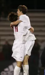 Sophomores Brian Ackley and John Mellencamp celebrate the win against Kentucky.
