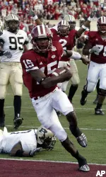 Kellen Lewis crosses the goal line to score during the first half. (AP Photo/Tom Strattman)