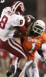 Indiana's Nick Polk (8) intercepts a pass intended for Oklahoma State's Dez Bryant (1) (AP Photo)