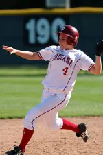 Jennilee Huddleston's RBI double tied the game in the bottom of the first before it went into a rain delay.