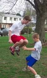 Billy Weaver plays keep away with a member of the Boys and Girls Club.