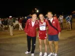 Assistant coach Sandy Tecklenburg, Jessica Gall and interim head coach Judy Wilson after the 10K on Thursday, June 7.