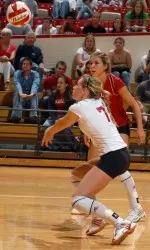 Morgan Miller (white jersey) and Juli Pierce (crimson jersey)