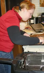 Lauren Harling tends to her dish at Iron Chef 2008.