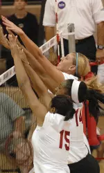 Erica Short, Lexie Woodson and Mary Chaudoin go up for the triple block