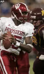 Kellen Lewis evades a Minnesota defender. (AP Photo/Paul Battaglia)