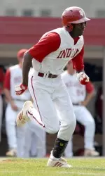 Evan Crawford had a single, double and triple in the Crimson's 7-3 victory over the Cream in the opening game of the Cream & Crimson World Series.